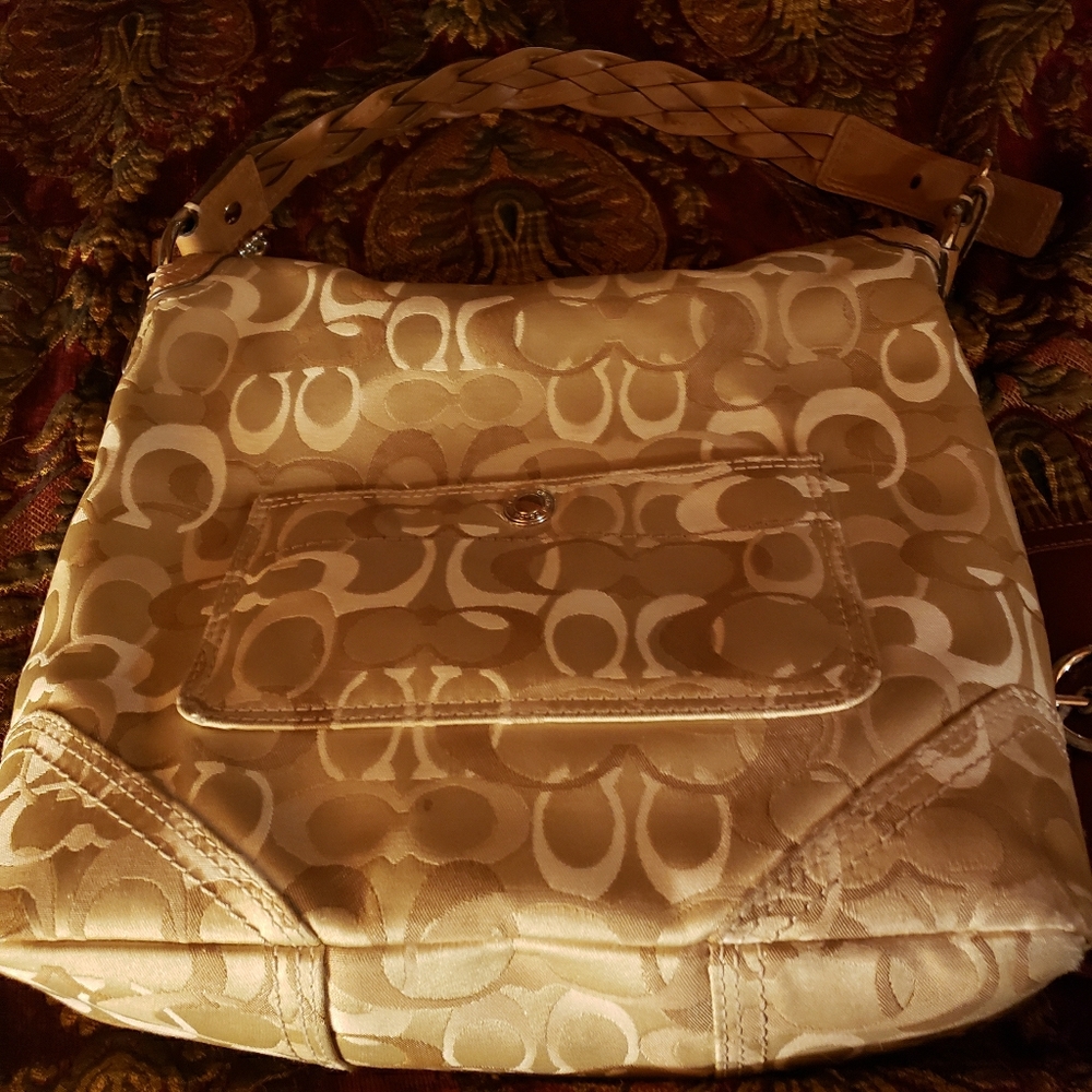 Coach clasp top hand bag golds and tan.